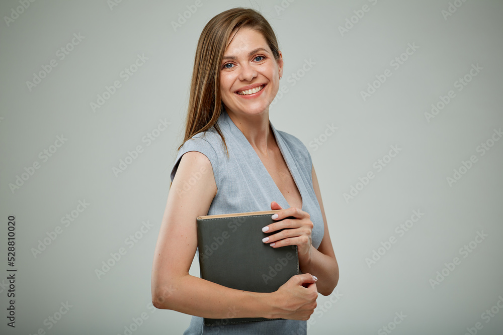Smiling student girl or female businessperon with book. Isolated portrait of young teacher. Smiling student girl or female businessperon with book. Isolated portrait of young teacher.