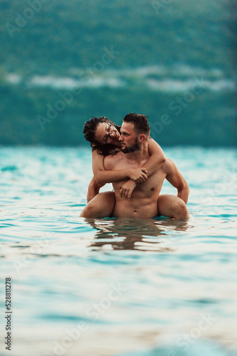 A sexy couple comes out of the sea after swimming. High quality photo © Minet