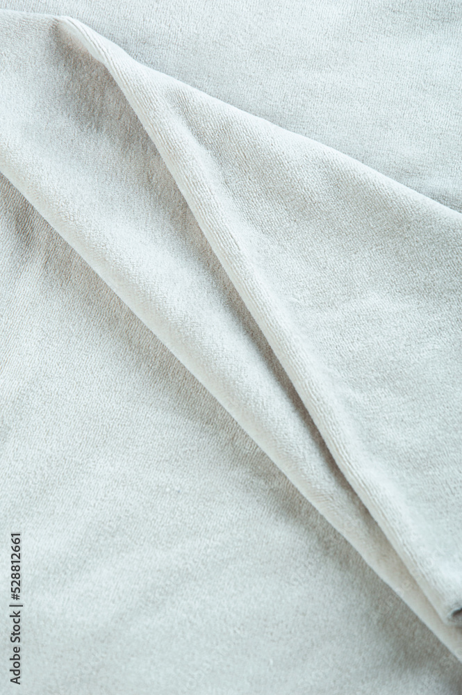 Fototapeta premium Solid color plush fabric of delicate color on a light background
