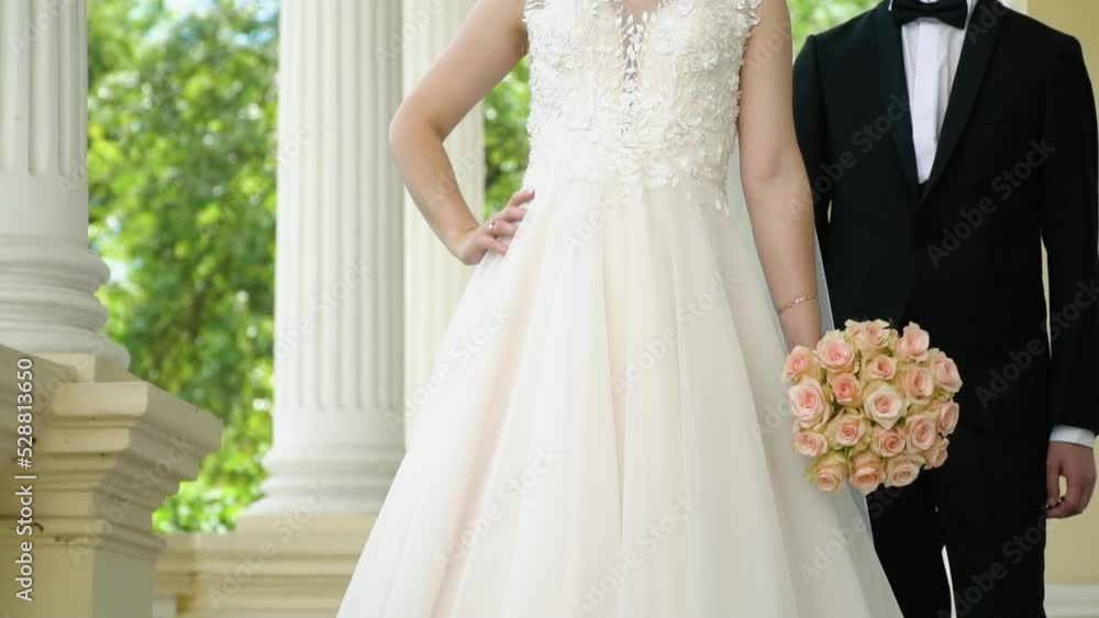 Wedding couple outdoors. Beautiful model girl in white dress. Man in suit. Beauty bride with groom. Female and male portrait. Cute lady and handsome guy Wedding couple outdoors. Beautiful model girl in white dress. Man in suit. Beauty bride with groom. Female and male portrait. Cute lady and handsome guy