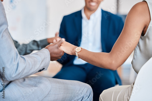 Team  support group and business people holding hands in support and trust circle in a meeting at the workplace. Teamwork  collaboration and relationship of coworkers together in agreement at office