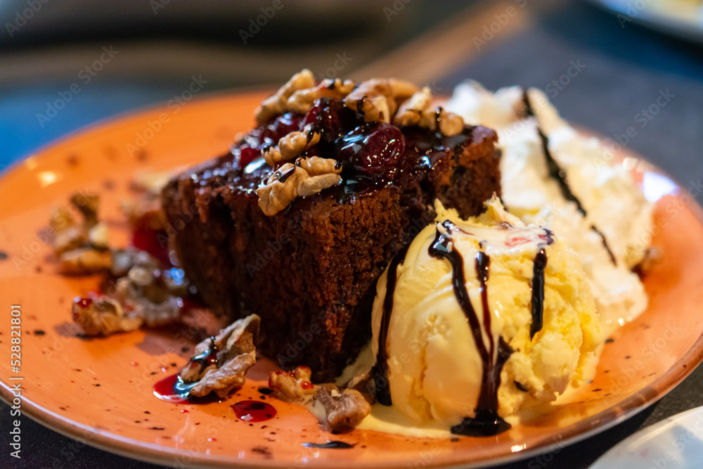 Piece of brownie chocolate cake with vanilla ice cream Piece of brownie chocolate cake with vanilla ice cream