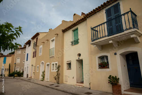Colorful houses in Port Grimaud  village on Mediterranean sea with yacht harbour  Provence  France