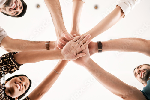 Teamwork, support and hands of business people in motivation, vision and innovation team building. Networking, collaboration and diversity with employees in goals, strategy and success meeting © M Einero/peopleimages.com