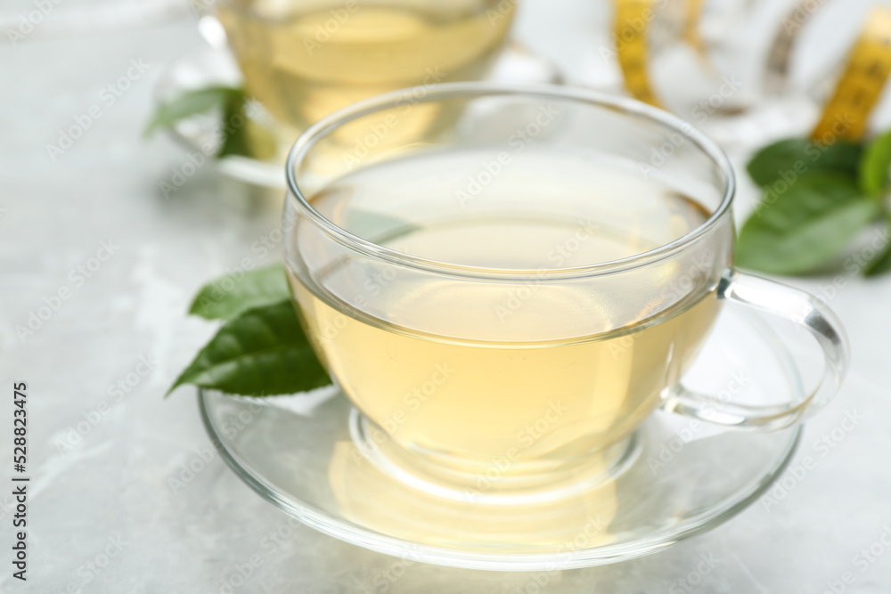 Herbal diet tea on light table, closeup Herbal diet tea on light table, closeup
