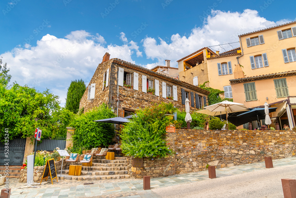 Shops, cafes and homes in the medieval hilltop village of Grimaud, France, in the hills above Saint-Tropez in the Cote d'Azur.