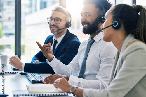 Teamwork, diversity and collaboration, a team of call centre employees working together. Men, woman and customer service, contact us for help. Telemarketing, consulting and communication with a smile