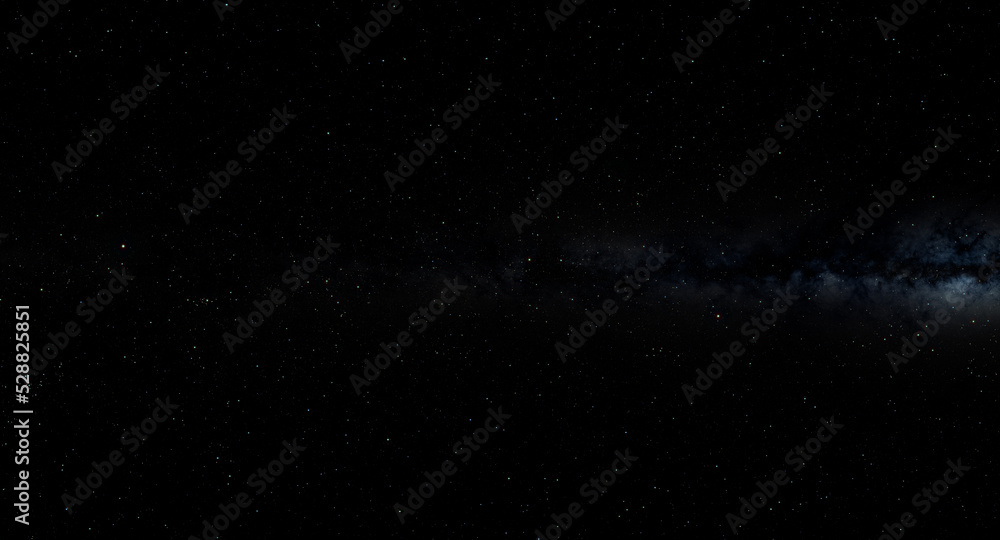 Fototapeta premium A black and white night sky filled with stars, with the Milky Way stretching across the horizon. The stars twinkle in the darkness, creating a beautiful and serene atmosphere.