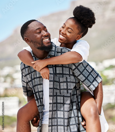 Love, happy and relax couple on beach date while on travel vacation, holiday or romantic summer honeymoon getaway. Support, romance and partnership for married black man carrying woman on Brazil trip
