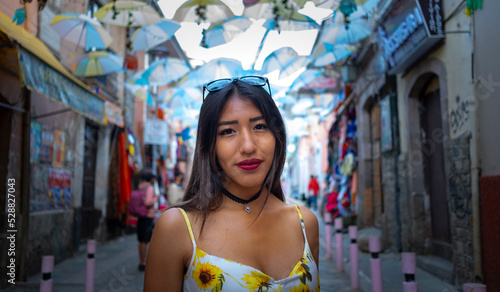 brunette woman looking straight ahead in the streets of bolivia