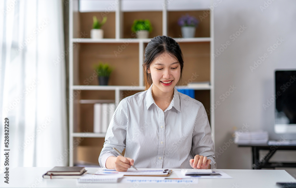 Asian business woman taking notes on online meetings on the Internet through a laptop in an open office business idea Data Analysis, Roadmap, Marketing, Accounting, Auditing Asian business woman taking notes on online meetings on the Internet through a laptop in an open office business idea Data Analysis, Roadmap, Marketing, Accounting, Auditing
