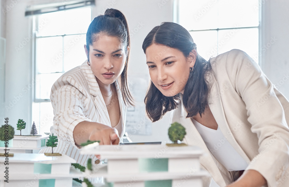 Fototapeta premium Architect, team and engineer meeting while women discuss 3d architectural model vision. Teamwork and collaboration while talking and planning construction building prototype design project in office