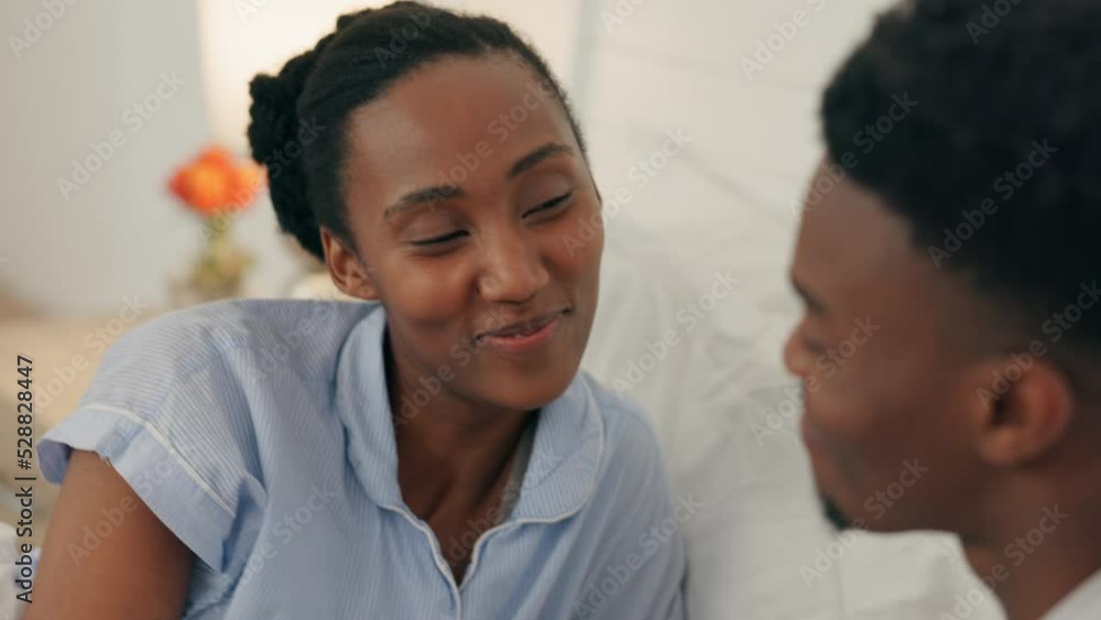 Love, kiss and happy couple holding hands while relax together on a bed at home. Happy black boyfriend and girlfriend sharing intimate moments in a loving relationship while bonding in the morning Love, kiss and happy couple holding hands while relax together on a bed at home. Happy black boyfriend and girlfriend sharing intimate moments in a loving relationship while bonding in the morning