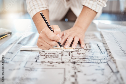Architect drawing building floor plan, design blueprint map and engineer drafting structure on table paper. Real estate development work office construction and industrial wall safety ruler