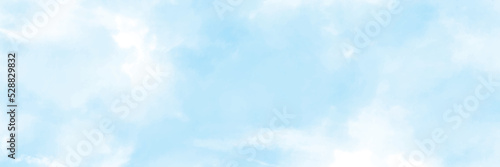 Blue sky in the soft white clouds. Natural cloudscape background, texture. Wide Horizontal Wallpaper With Copy Space