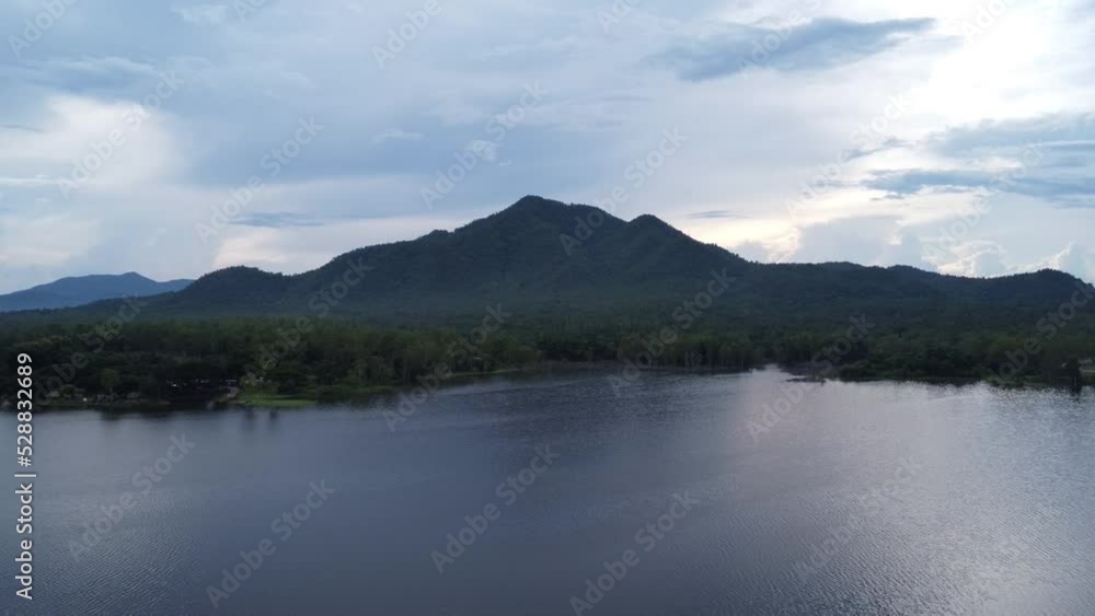 Aerial view of reservoir on tropical mountain background at sunset in northern Thailand. Beautiful landscape nature background. Aerial view of reservoir on tropical mountain background at sunset in northern Thailand. Beautiful landscape nature background.