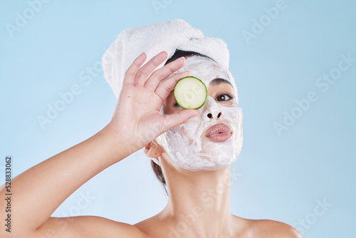 Skincare, cucumber and beauty face mask portrait of a beautiful woman taking natural care of her clean and healthy skin. Fresh, wellness and relax during routine pamper spa cosmetology treatment
