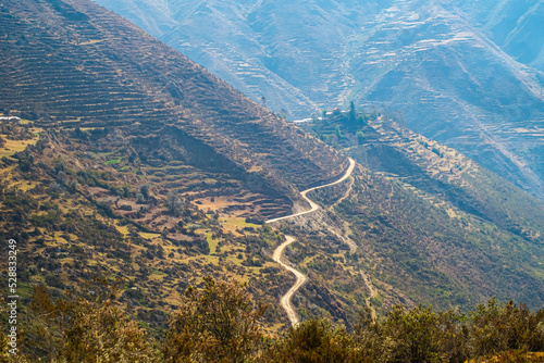 landscape crossed by a trail road in the foothills of the peruvian Andes