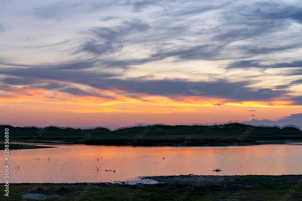 Sunrise reflecting off the tidal marsh near Cape Point in the Outer Banks Hatteras Island