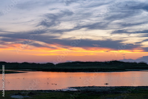 Sunrise reflecting off the tidal marsh near Cape Point in the Outer Banks Hatteras Island