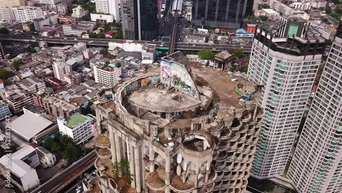 Drone shots of the famous Sathorn Unique Tower (Ghost Tower) in Bangkok, Thailand photo