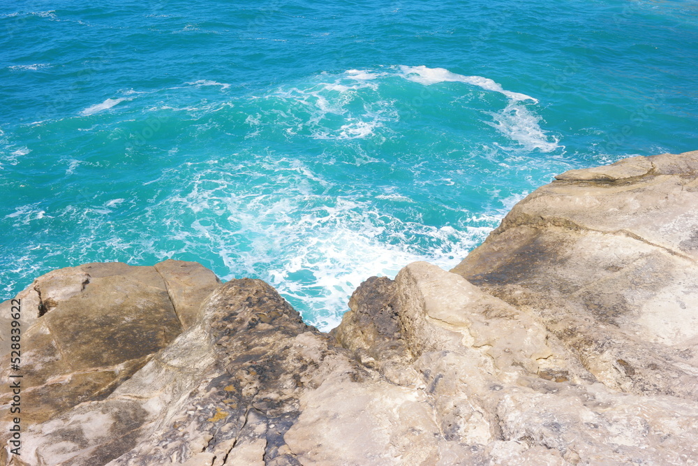 Sea waves greets the rocks at the beach Sea waves greets the rocks at the beach
