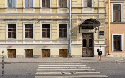 Old building, pedestrian and crosswalk in St. Petersburg