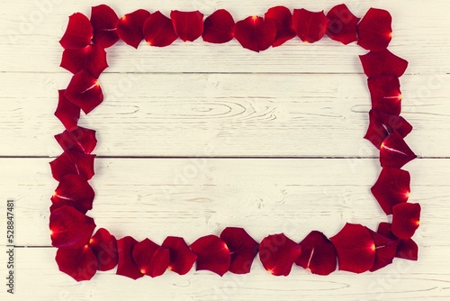 Fototapeta Naklejka Na Ścianę i Meble -  Frame of red rose petals