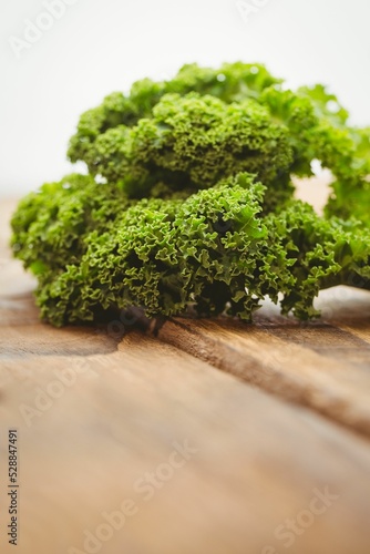 Close-up of parsley on wooden board 
