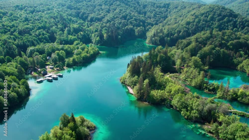 Drone aerial view of beautiful Plitvice Lakes National Park waterfalls crystal clear water, forward, sunny day Drone aerial view of beautiful Plitvice Lakes National Park waterfalls crystal clear water, forward, sunny day