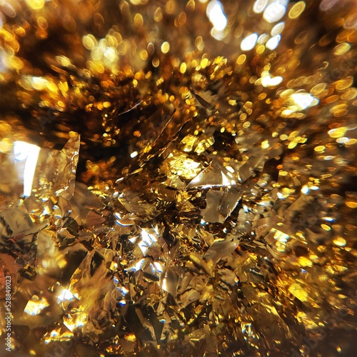 ゴールドカラーのホログラフィックフレークを敷き詰めた背景写真　質感素材 © たまき岬