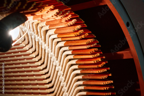 The stator of an industrial electric motor in the process of being assembled.