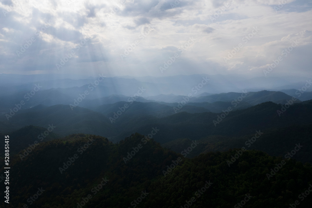 mountain ridge and clouds in rural jungle bush forest
