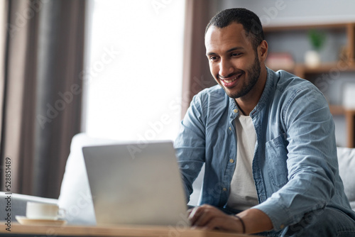 Remote Office. Portrait Of Handsome Black Guy Working With laptop At Home
