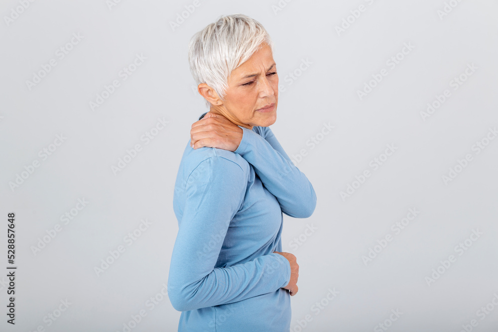 Senior woman with shoulder pain. Elderly woman is enduring awful ache