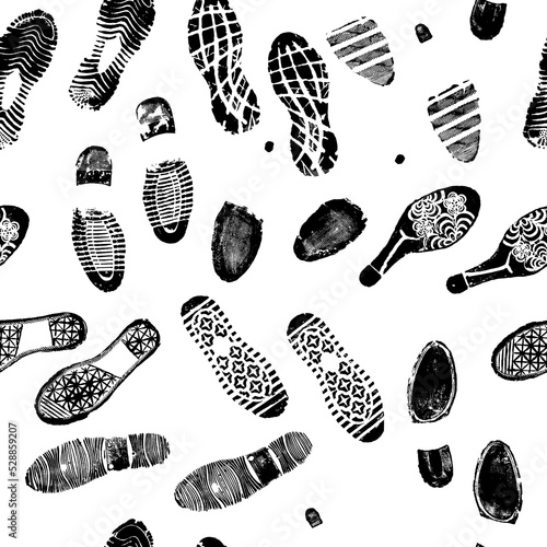 Vector seamless pattern image double footprints black footprints on white background