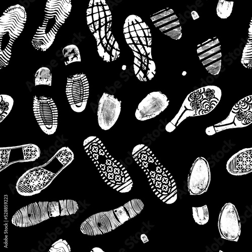 Vector seamless pattern image double footprints white footprints on black background