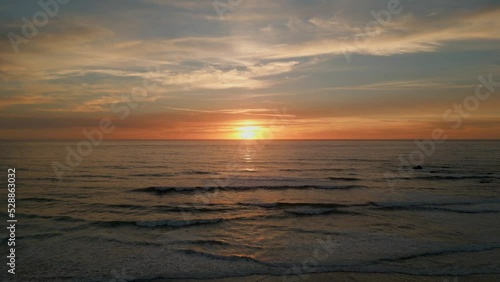 Aerial drone shot of sunset at the beach in the Oregon coast.