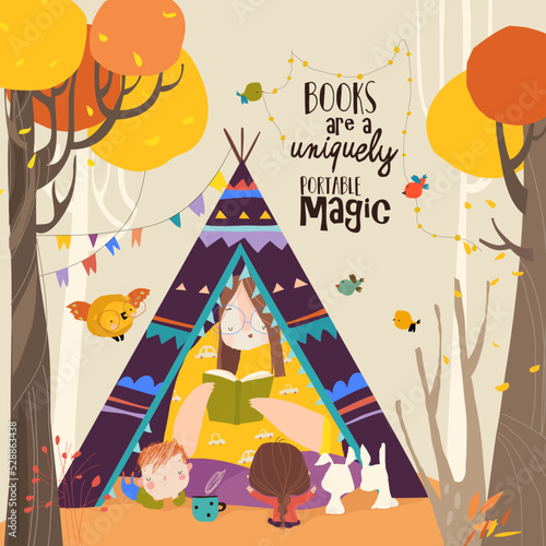 Mother reading Book with Her Children in a Teepee Tent in Autumn Park