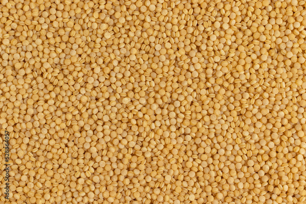 Coarse organic groats couscous. Top view, full frame photo. Coarse organic groats couscous. Top view, full frame photo.