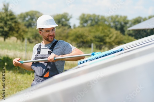 man cleaning, solar power washing