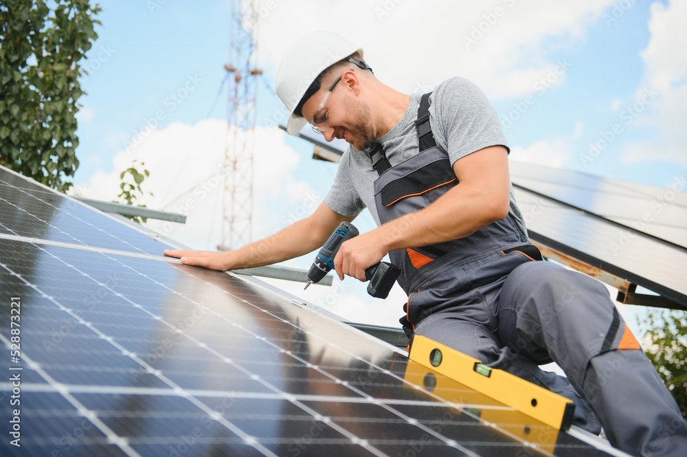 A man working at solar power station. A man working at solar power station.