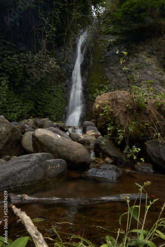 photo of a hidden waterfall, which is in Indonesia, a waterfall with a small water discharge