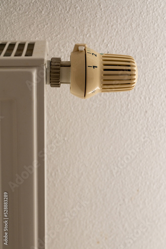 Detail of thermostat and regulator in old house radiator. Increasing prices of energies and heat