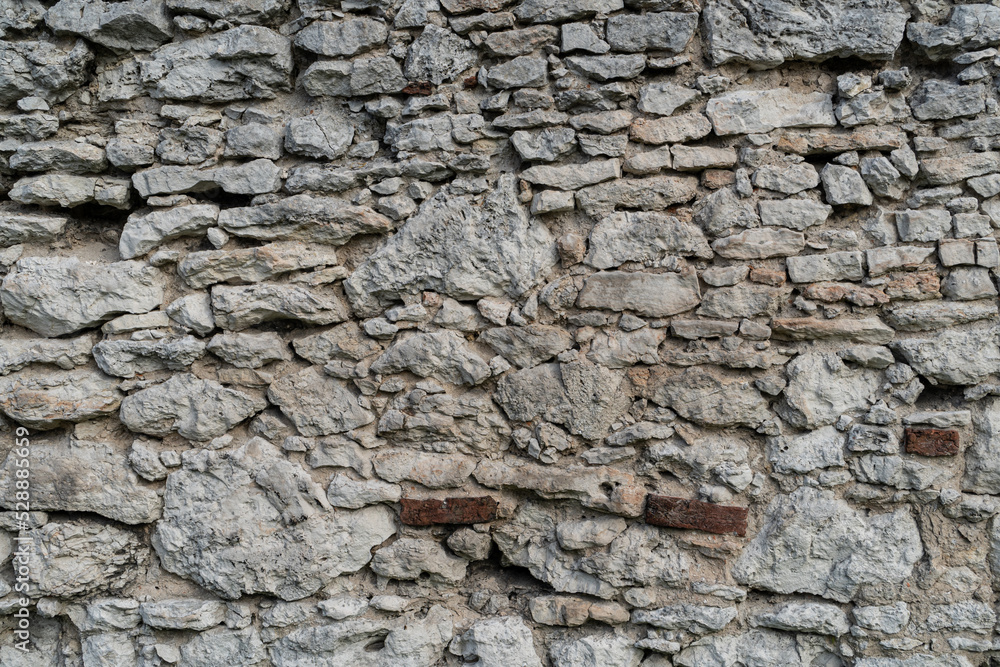 Background image of old stone wall. Medieval defensive walls texture.