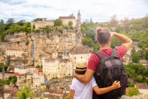 children and father looking panoramic view of Rocamadour- France © M.studio