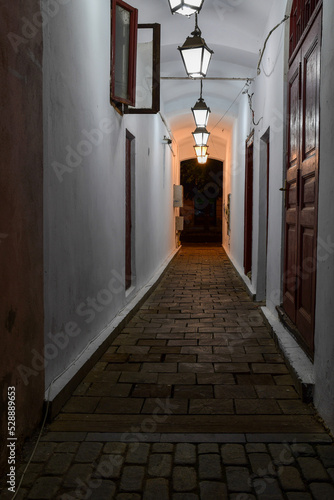 narrow passageway in the city at night