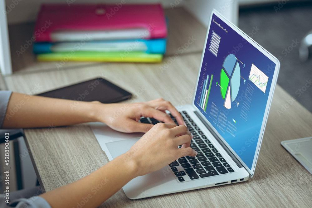 Caucasian businesswoman using laptop with data processing Caucasian businesswoman using laptop with data processing