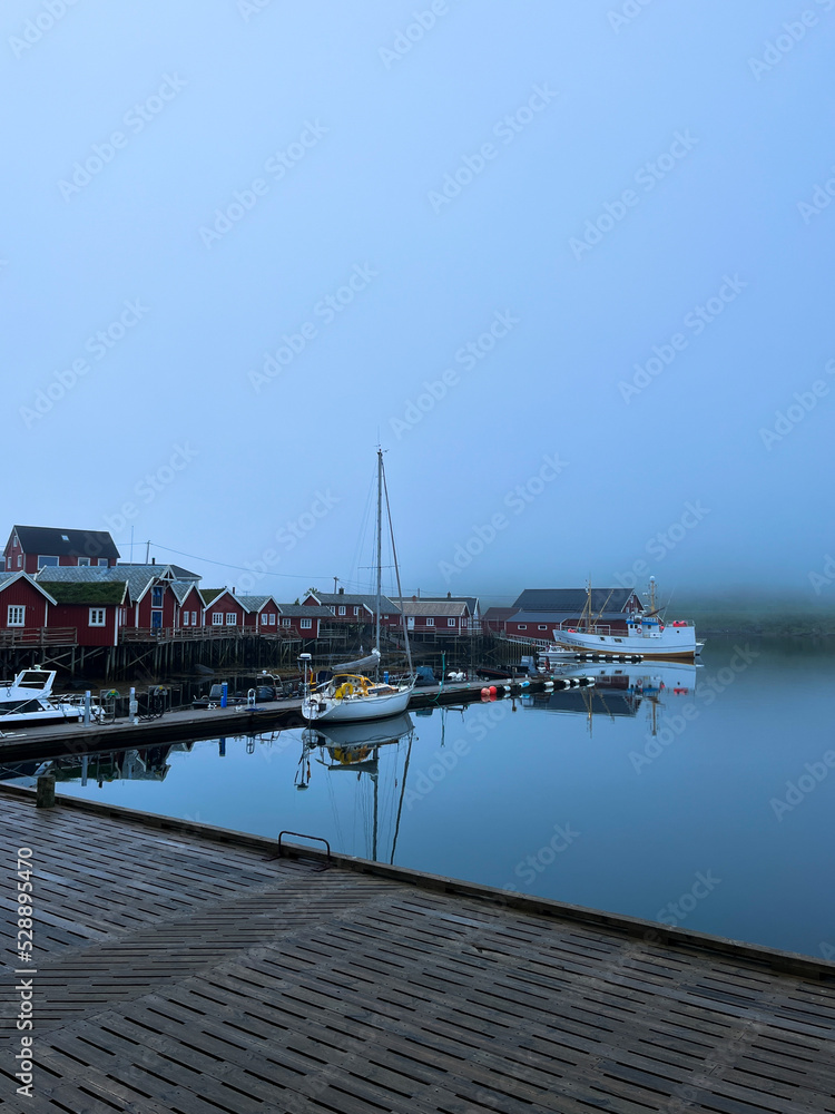 Boats pier in the fog, misty seascape