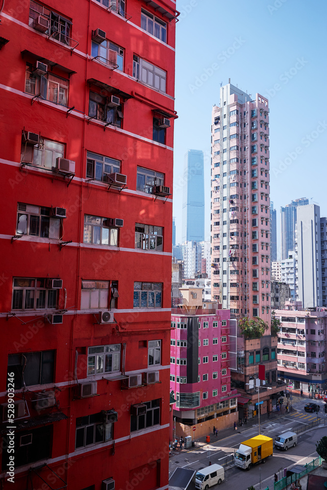 Architecture of Hong Kong City. Backyard of red painted condominium.